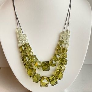 Green cube necklace in faceted acrylic on gunmetal chains tiered and graduated